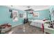An aqua bedroom with a window and closet at 925 Forest Dr, Anderson, IN 46011