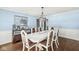Elegant dining room featuring a decorative mirror, a modern chandelier, and a spacious layout at 925 Forest Dr, Anderson, IN 46011