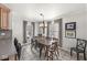 Bright dining area with large windows and a wooden dining set at 925 Forest Dr, Anderson, IN 46011