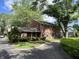 Beautiful two-story brick home with a well-maintained lawn and mature trees at 925 Forest Dr, Anderson, IN 46011