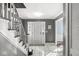 Warm foyer with a view of the front door, showcasing tiled floors and stylish decor; perfect for welcoming guests at 925 Forest Dr, Anderson, IN 46011