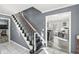 Open foyer with staircase; seamlessly transitions to a living area, enhancing the home's flow and spacious feel at 925 Forest Dr, Anderson, IN 46011