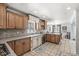 Well-appointed kitchen featuring custom cabinetry, a tile backsplash, and stainless steel appliances at 925 Forest Dr, Anderson, IN 46011
