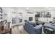 Cozy living room featuring a fireplace, built-in shelving, and ample natural light from the french doors at 925 Forest Dr, Anderson, IN 46011