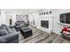 Cozy living room showcasing a fireplace, comfortable seating, and easy access to an outdoor patio at 925 Forest Dr, Anderson, IN 46011