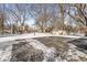 Large backyard with a basketball hoop, storage shed, a tree house and ample open space at 925 Forest Dr, Anderson, IN 46011