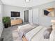 Bedroom featuring neutral paint, a television, and closet space at 102 Plummer Ave, Bargersville, IN 46106