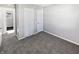 Bedroom with gray carpet, white trim, and a closet at 102 Plummer Ave, Bargersville, IN 46106