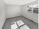 Bedroom with neutral walls and a window offering natural light and plush gray carpet at 102 Plummer Ave, Bargersville, IN 46106