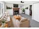 Living room featuring a fireplace, neutral paint, ceiling fan, and lots of natural light at 102 Plummer Ave, Bargersville, IN 46106
