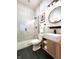 Bathroom features a glass enclosed shower, wood grain vanity, and modern lighting at 1042 Nelson Ave, Indianapolis, IN 46203