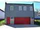 Garage featuring a red door, gray facade, and contemporary design at 1042 Nelson Ave, Indianapolis, IN 46203