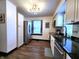 Renovated kitchen featuring stainless steel appliances, granite countertops, and wood flooring at 1042 Nelson Ave, Indianapolis, IN 46203