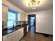 Updated kitchen with stainless steel appliances, new cabinets, modern countertops, and updated flooring at 1042 Nelson Ave, Indianapolis, IN 46203