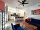 Modern living room and kitchen is bathed in natural light and features stylish decor at 1042 Nelson Ave, Indianapolis, IN 46203
