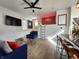 Stylish living room with neon lighting, a loft, and contemporary furniture at 1042 Nelson Ave, Indianapolis, IN 46203