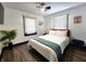 Bright main bedroom with hardwood floors, comfortable bed, stylish decor, and natural light at 1042 Nelson Ave, Indianapolis, IN 46203