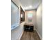 Small office nook with desk, rolling chair, natural light, and board with information at 1042 Nelson Ave, Indianapolis, IN 46203