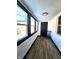Bright sunroom featuring modern lighting, windows, and new flooring at 1042 Nelson Ave, Indianapolis, IN 46203