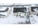 Aerial view of a snow covered suburban house with a backyard at 1136 Meriman Dr, Greenwood, IN 46143