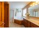 Bathroom featuring a large soaking tub, separate shower, and double sink vanity at 1136 Meriman Dr, Greenwood, IN 46143