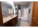 Standard bathroom featuring a vanity with sink, toilet, and a shower-tub combination at 1136 Meriman Dr, Greenwood, IN 46143