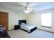 Bright bedroom with large window, fan, and simple decor at 1136 Meriman Dr, Greenwood, IN 46143