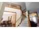 Inviting foyer showcasing the staircase and open access to the dining and living spaces at 1136 Meriman Dr, Greenwood, IN 46143