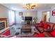 Comfortable living room features a fireplace, ceiling fan, and modern decor at 1136 Meriman Dr, Greenwood, IN 46143