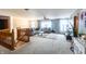 Spacious living room with plush carpet, comfortable seating, and plenty of natural light at 1136 Meriman Dr, Greenwood, IN 46143