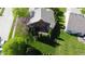 Aerial perspective showcasing a house with a fenced backyard, mature trees, and a charming patio area at 1232 Severn Ct, Greenwood, IN 46142