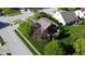 Aerial view of a home with a well-manicured lawn, mature trees, and a spacious backyard in a suburban neighborhood at 1232 Severn Ct, Greenwood, IN 46142