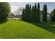 Spacious backyard with green grass and privacy trees, ideal for outdoor activities and relaxation at 1232 Severn Ct, Greenwood, IN 46142