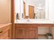 Bright bathroom featuring a wood vanity with marble countertop and a shower with glass doors at 1232 Severn Ct, Greenwood, IN 46142