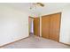Bedroom with neutral carpet, ceiling fan, and closet with wood sliding doors at 1232 Severn Ct, Greenwood, IN 46142