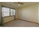 Bright bedroom with a large window and neutral carpet, offering a serene living space at 1232 Severn Ct, Greenwood, IN 46142