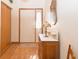 Inviting entryway featuring hardwood floors, a decorative lamp, and a white front door at 1232 Severn Ct, Greenwood, IN 46142