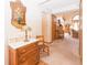 Warm entryway with hardwood floors, decorative lamp, and a glimpse into the living room at 1232 Severn Ct, Greenwood, IN 46142