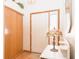 Inviting entryway featuring a wood-look closet and white marble-topped table with a stained-glass accent lamp at 1232 Severn Ct, Greenwood, IN 46142