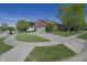 Cozy brick home with a two-car garage and a well-manicured lawn on a sunny day at 1232 Severn Ct, Greenwood, IN 46142