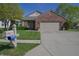 Attractive brick home with a well-manicured lawn, mailbox and an attached two-car garage at 1232 Severn Ct, Greenwood, IN 46142