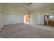Open living room features neutral tones, a ceiling fan and flows into kitchen at 1232 Severn Ct, Greenwood, IN 46142