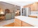 Open concept living room is visible from the kitchen with refrigerator at 1232 Severn Ct, Greenwood, IN 46142