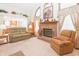 Inviting living room with vaulted ceilings, a cozy fireplace, and comfortable seating arrangement at 1232 Severn Ct, Greenwood, IN 46142