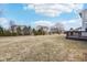 Well-maintained backyard featuring a mix of trees, shrubs, and open lawn space at 13750 Hiatt Dr, Carmel, IN 46074