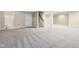 The carpeted basement is perfect for entertaining, with stairs and a nearby bathroom at 13750 Hiatt Dr, Carmel, IN 46074