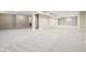 A large, carpeted basement is ready for customization, offering ample space and potential at 13750 Hiatt Dr, Carmel, IN 46074