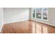 Sun-filled bedroom with hardwood floors and large windows providing natural light at 13750 Hiatt Dr, Carmel, IN 46074