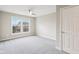 Bright, spacious bedroom features a large window and neutral carpeting for a cozy feel at 13750 Hiatt Dr, Carmel, IN 46074