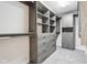 Walk-in closet with custom wood shelving, drawers, and ample storage space at 13750 Hiatt Dr, Carmel, IN 46074